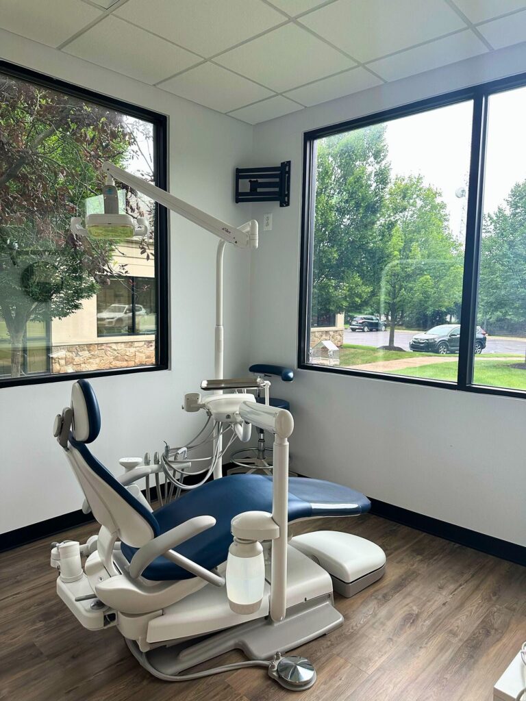 Dolan Dental treatment room with a dental chair and large window