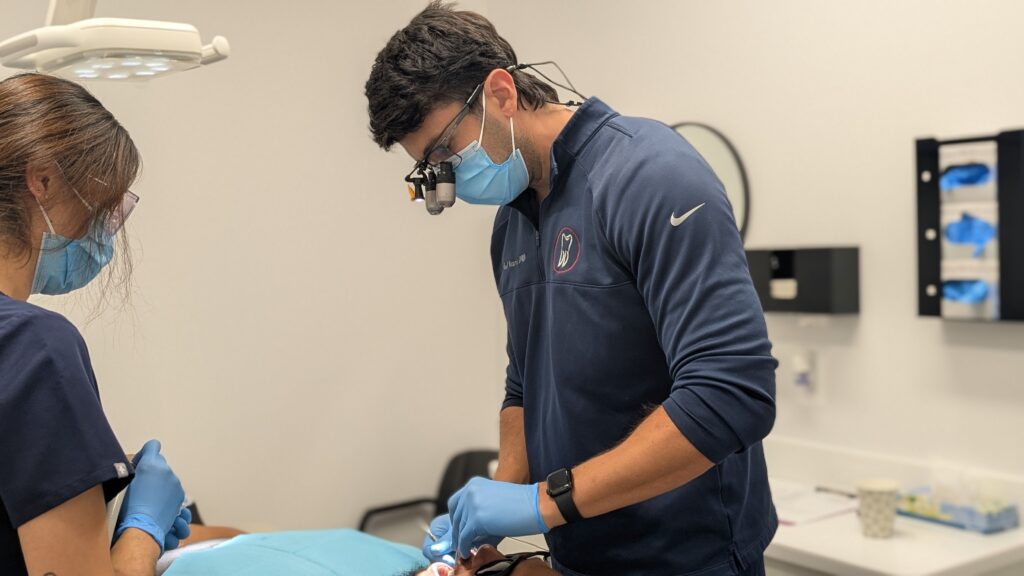 Dentist examining a patient’s teeth