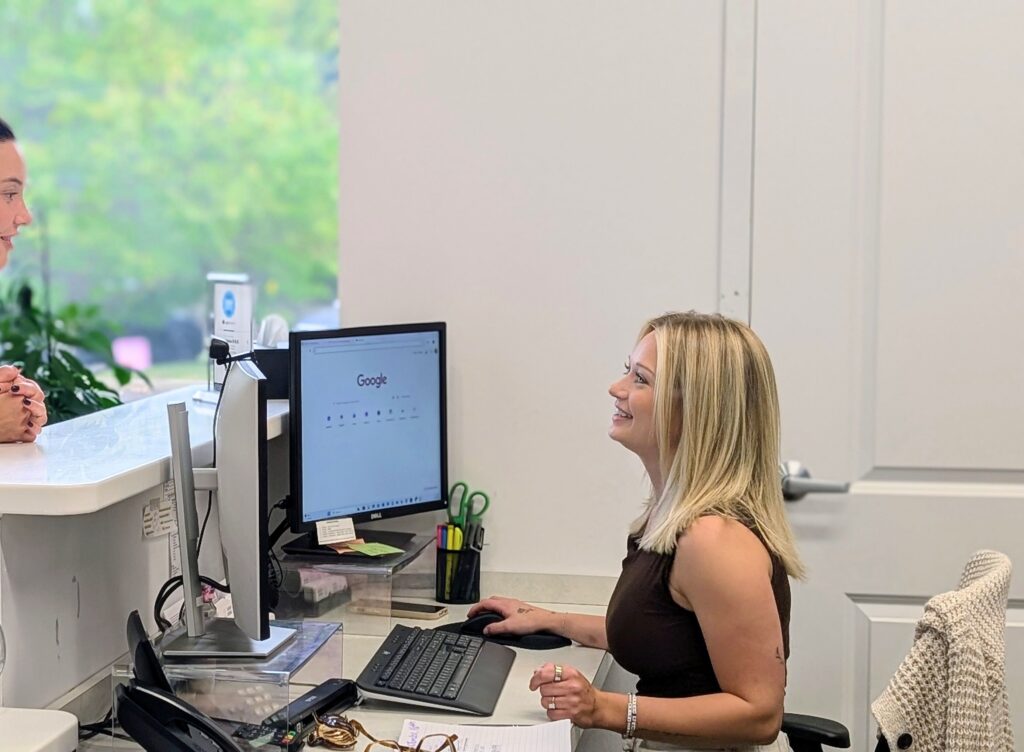 Dolan Dental team member working at a computer